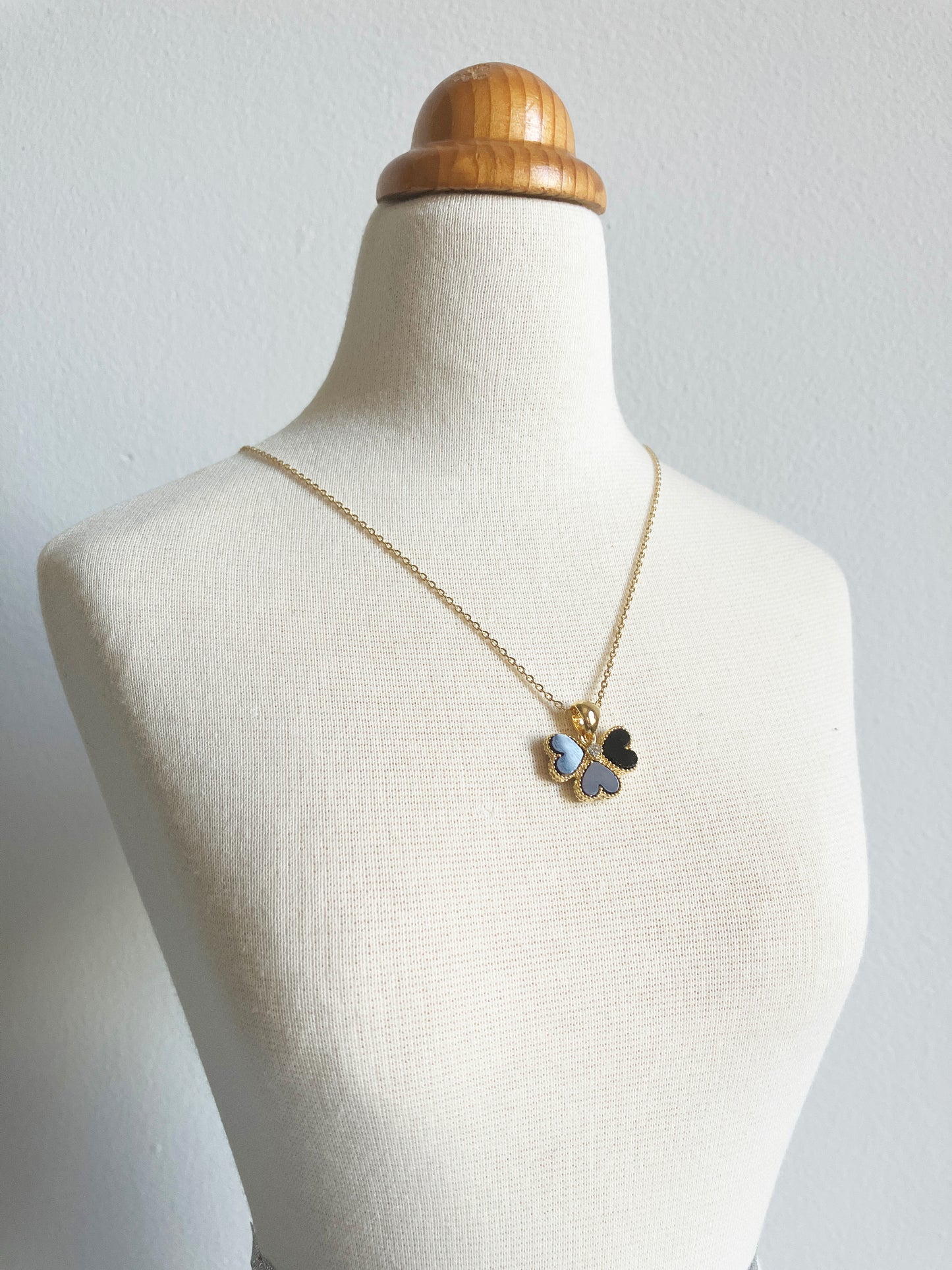 Clover of Hearts in Onyx and Cubic Zirconium Set in Gold