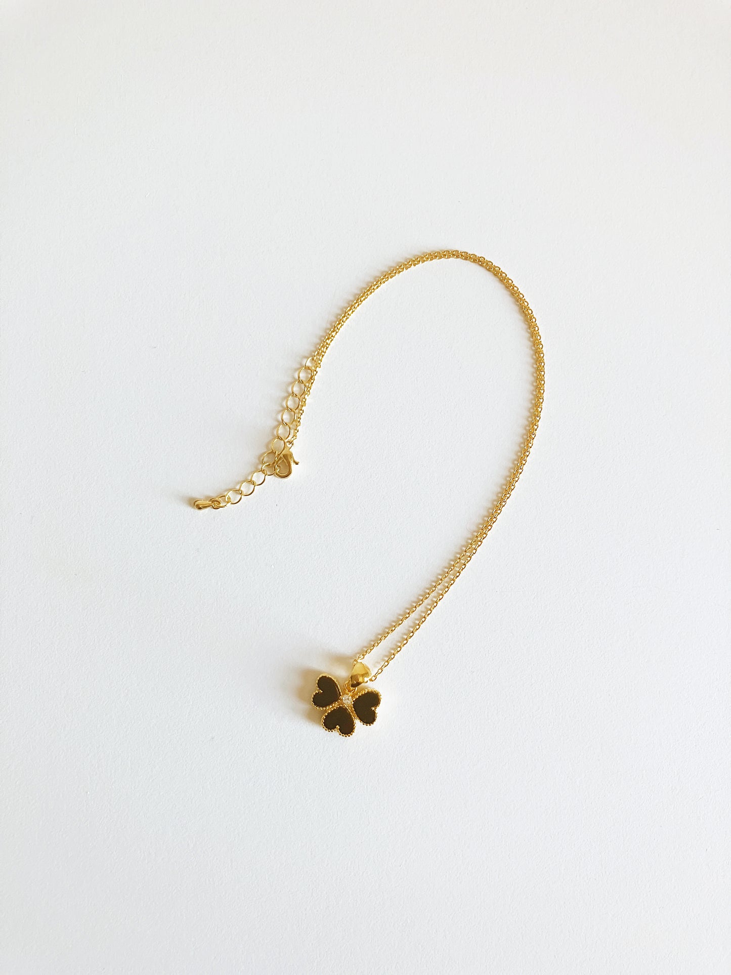 Clover of Hearts in Onyx and Cubic Zirconium Set in Gold