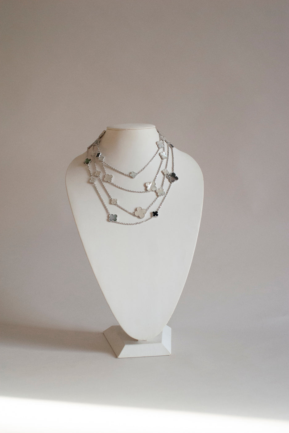 Mixed Size Onyx and White and Gray Mother of Pearl Quatrefoil Silver Plated Necklace