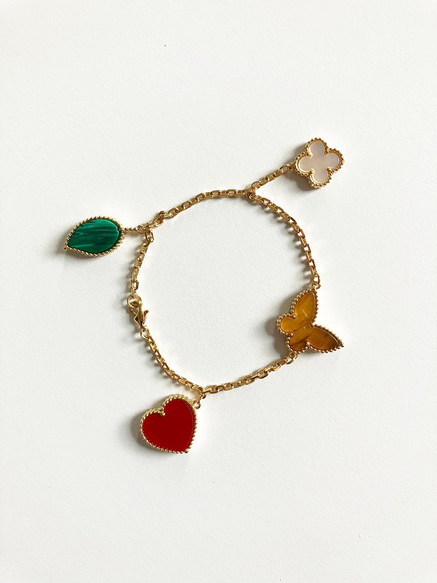 Heart and Butterfly Charm Bracelet in Mixed Stones and Gold