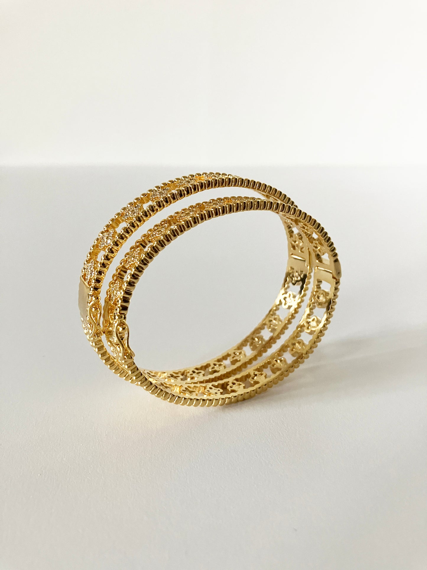 Small Floral Openwork Bangle in Gold and Cubic Zirconia