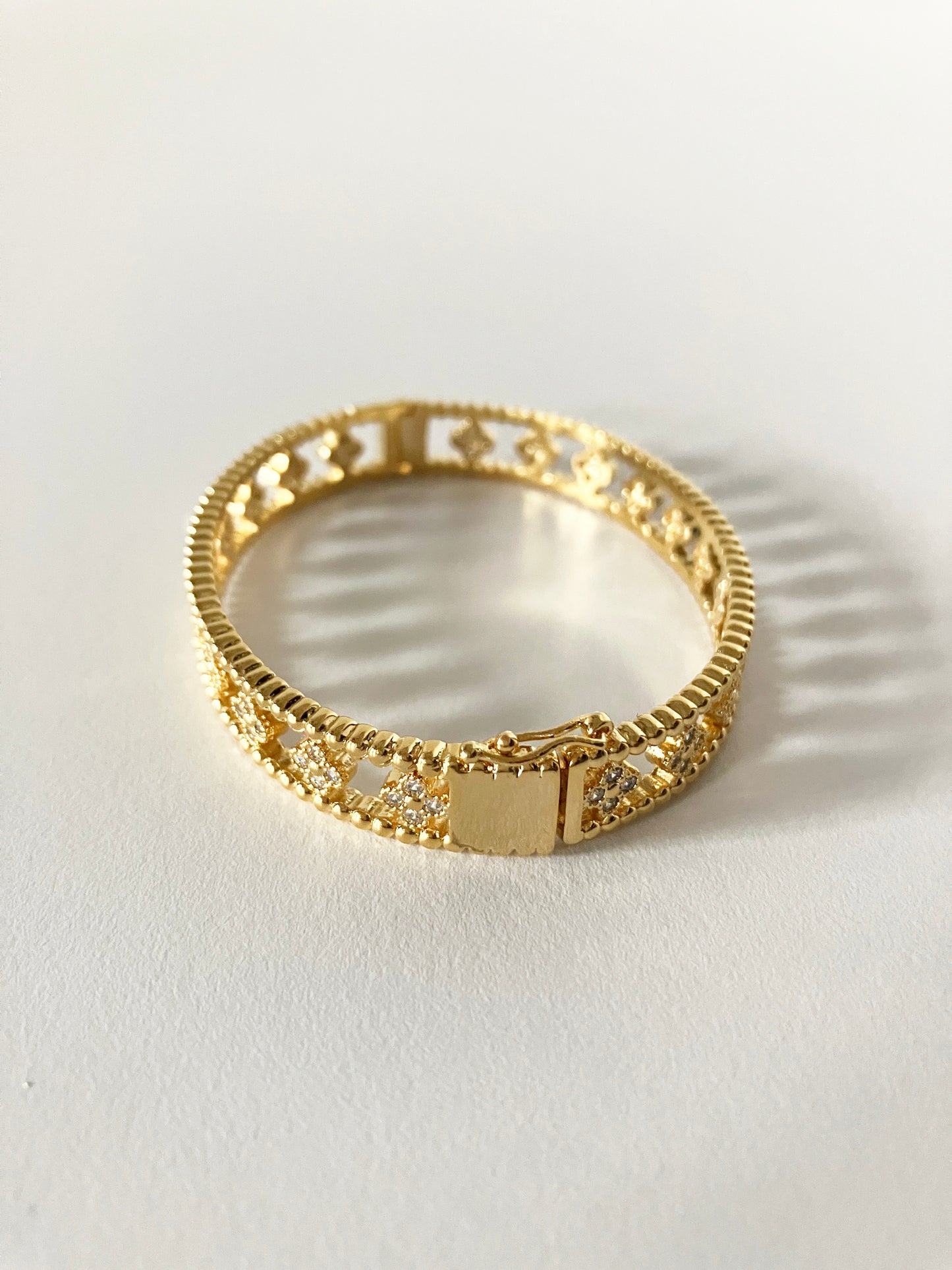 Large Floral Openwork Bangle in Gold and Cubic Zirconia