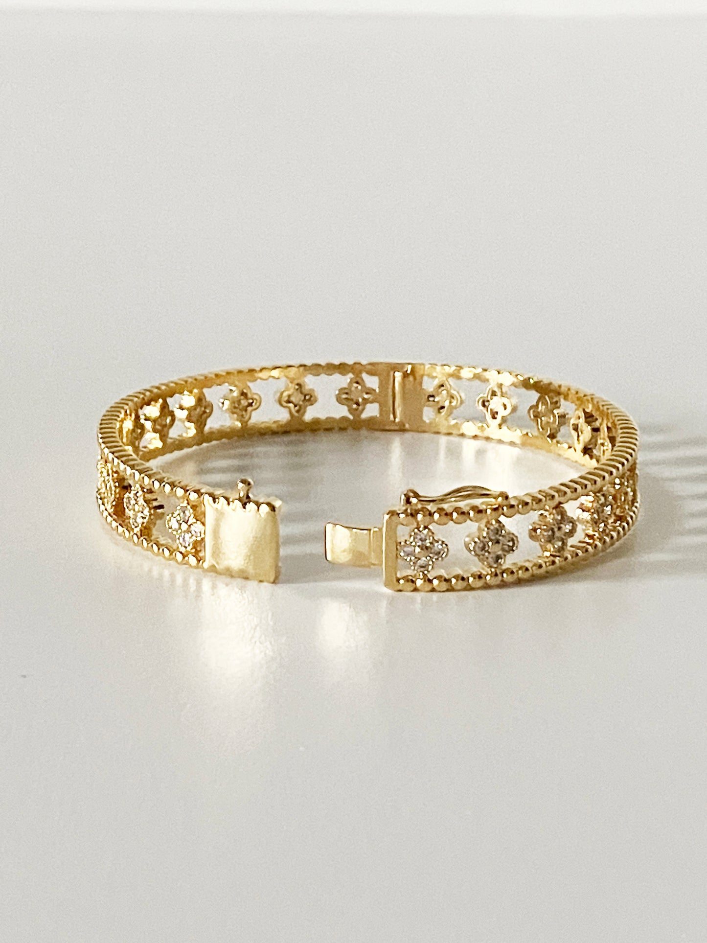 Large Floral Openwork Bangle in Gold and Cubic Zirconia