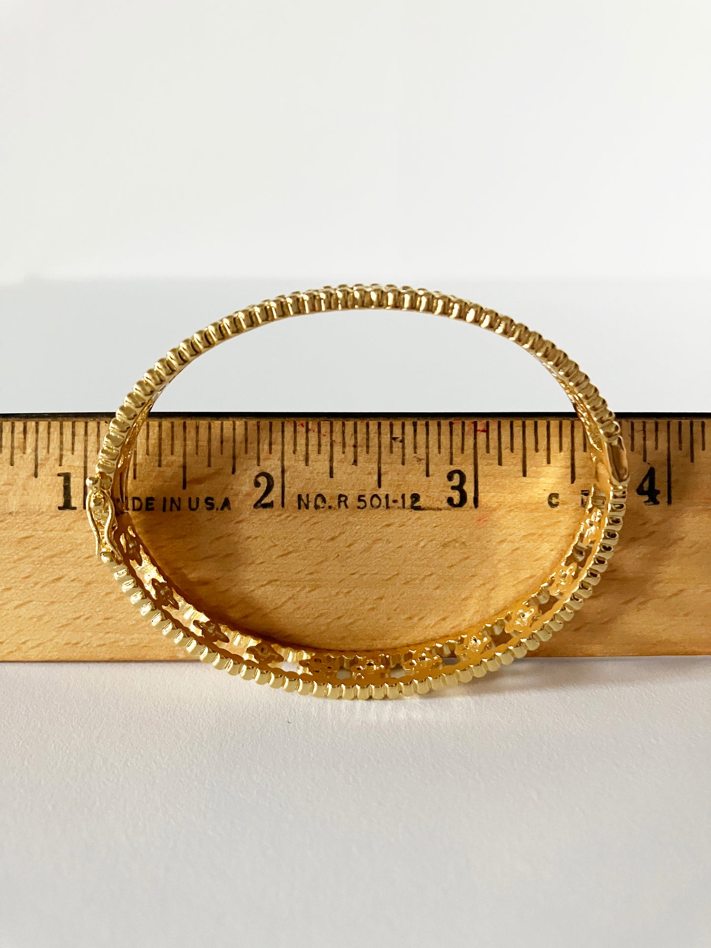 Small Floral Openwork Bangle in Gold and Cubic Zirconia