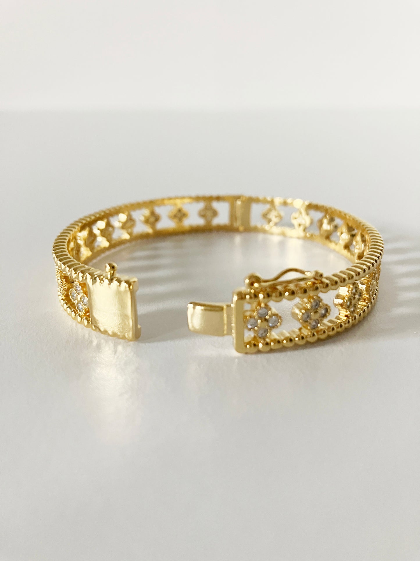 Small Floral Openwork Bangle in Gold and Cubic Zirconia